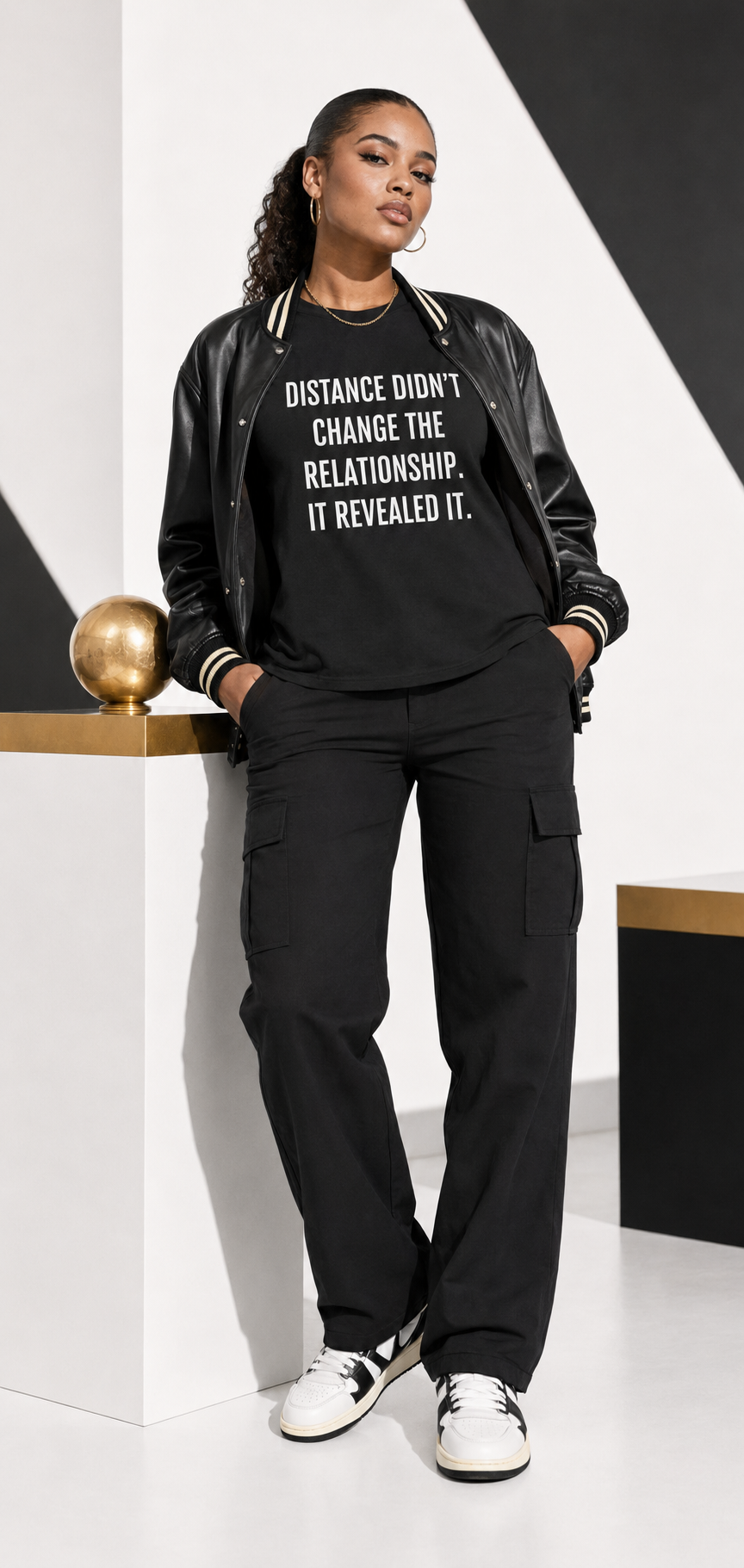 Young model styling a black BaWa statement T-shirt with a classy hip-hop look